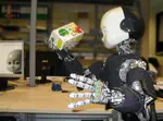 Active in-hand object recognition on a humanoid robot